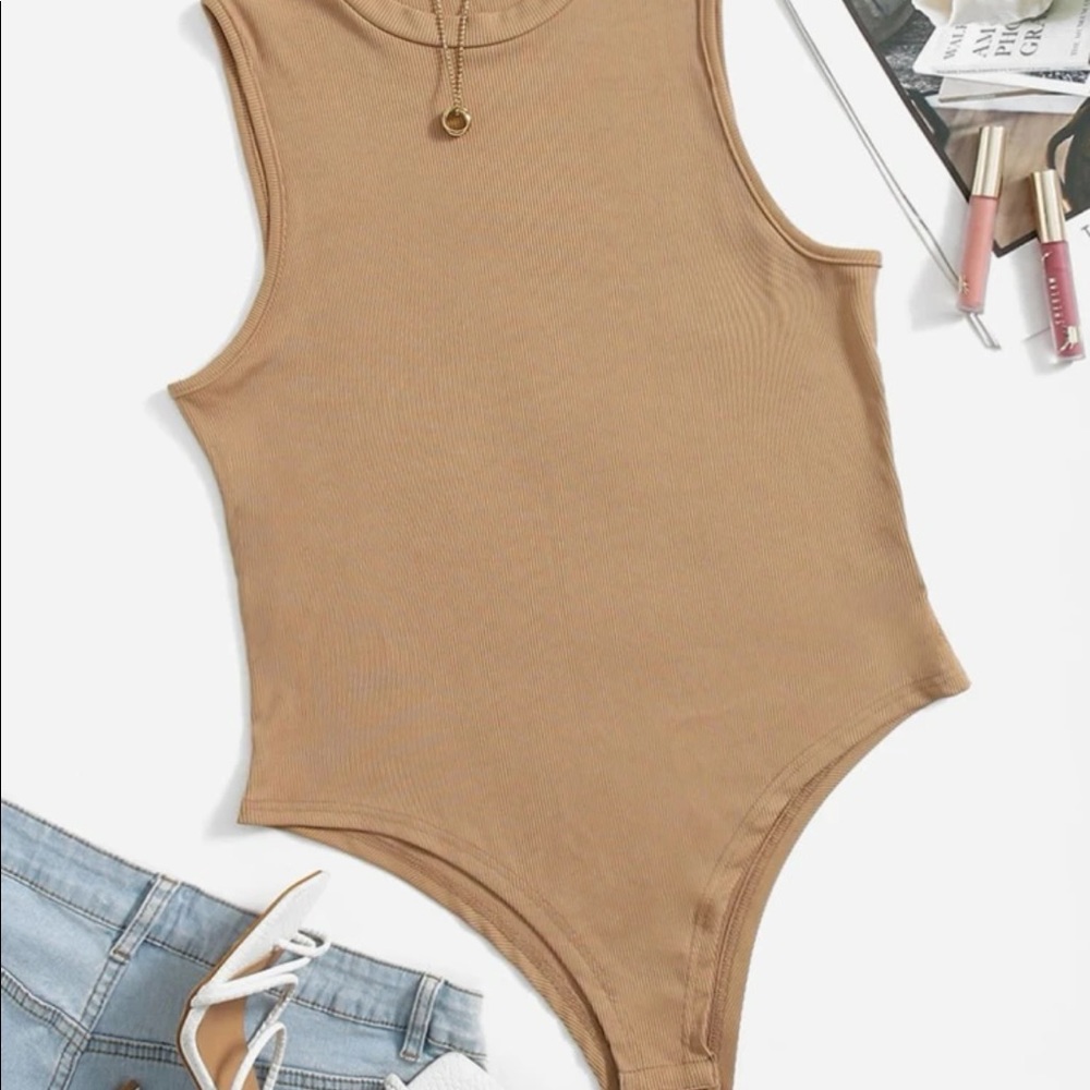 Never worn body suit beige color